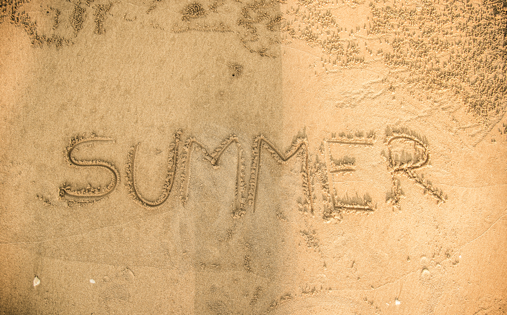 Summer written in the sand
