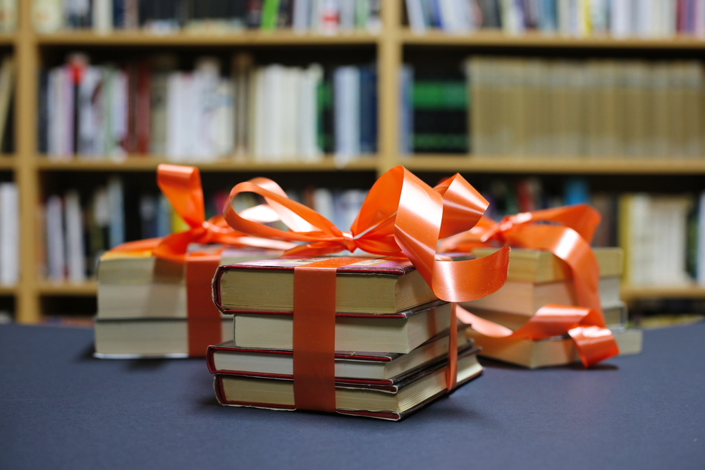 Books wrapped up and tied with a bow