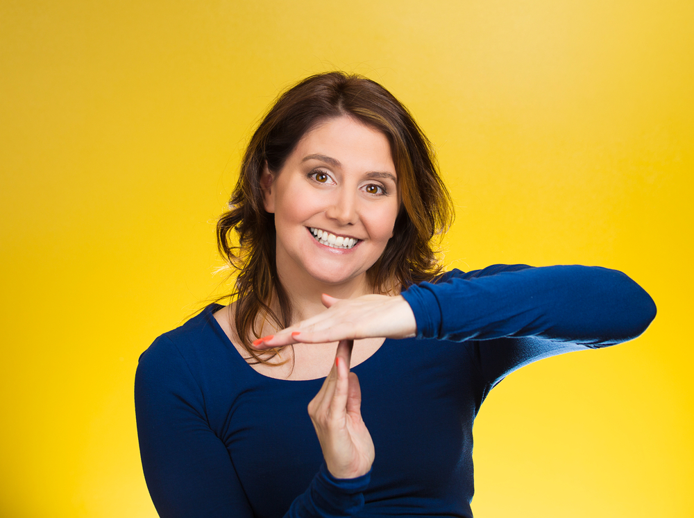 Woman showing time out gesture with hands
