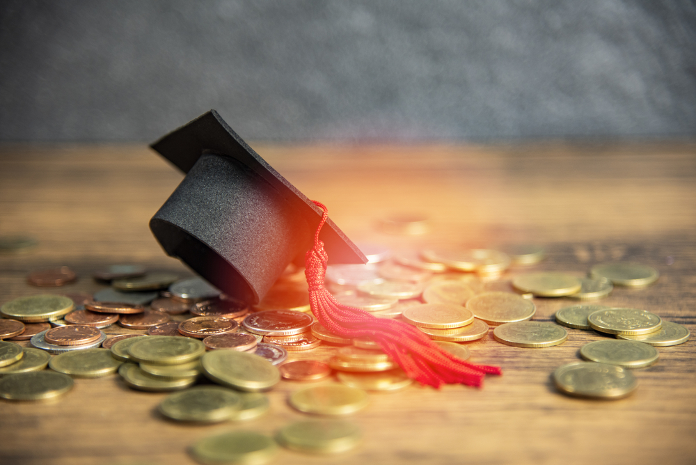 graduation cap and scholarship coins